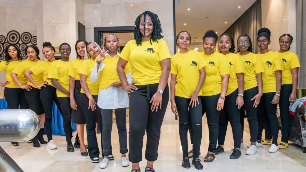 Bitcoin Dadas (meaning sisters) standing with yellow t-shirts